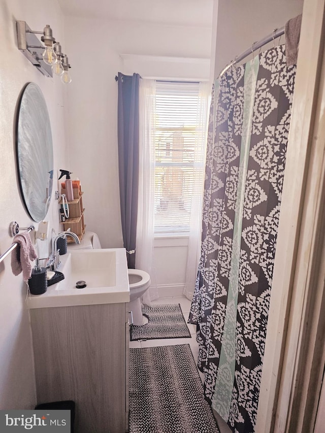 bathroom with vanity and toilet