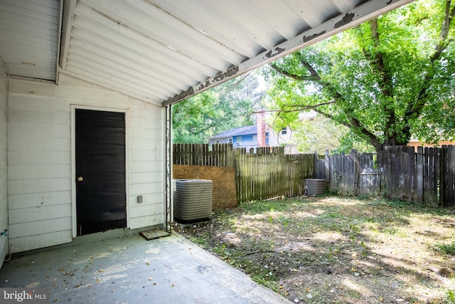 view of yard featuring cooling unit and a patio area