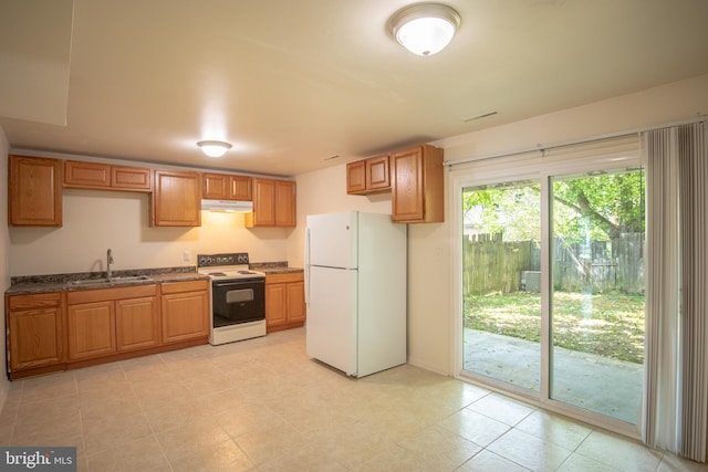 kitchen featuring sink and white appliances