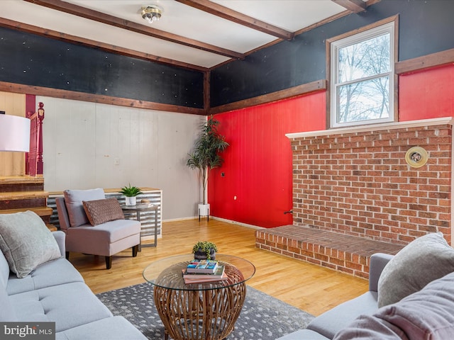 living room with hardwood / wood-style floors and beam ceiling