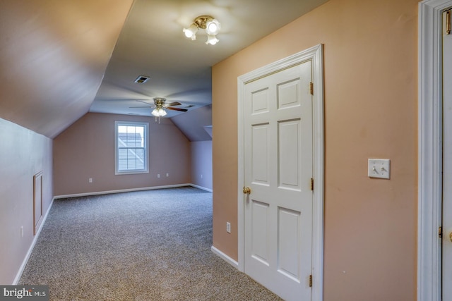 additional living space featuring carpet, ceiling fan, and lofted ceiling