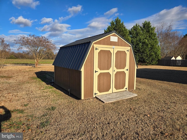 view of outbuilding featuring a lawn