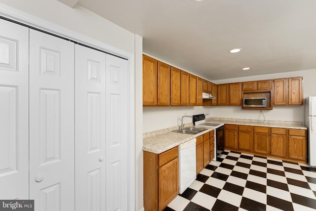 kitchen featuring sink and white appliances