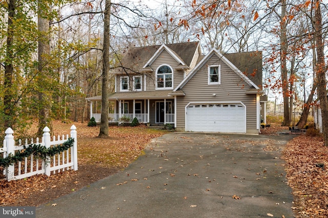 view of front facade with covered porch and a garage