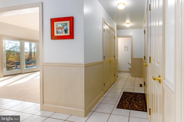 hallway featuring light tile patterned floors