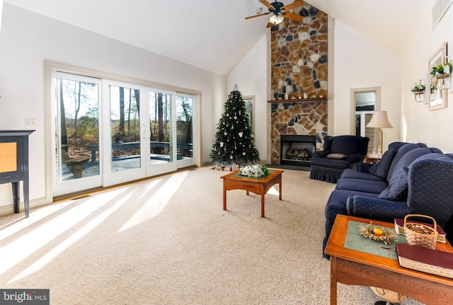 living room with carpet, high vaulted ceiling, ceiling fan, and a fireplace