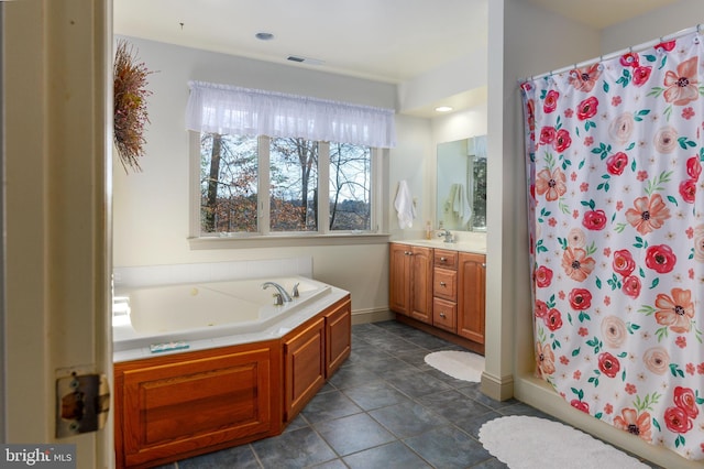 bathroom with tile patterned floors, vanity, and shower with separate bathtub