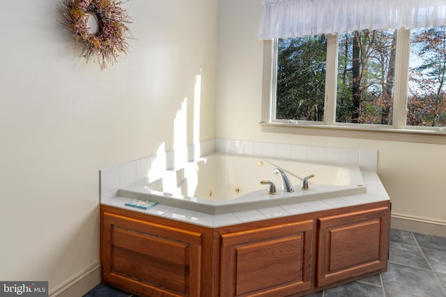 bathroom featuring tile patterned floors and a tub