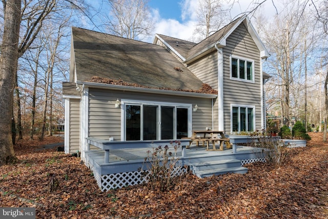 back of house with a wooden deck