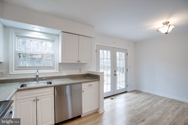 kitchen with white cabinets, french doors, stainless steel appliances, and a wealth of natural light