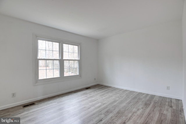 unfurnished room featuring light wood-type flooring