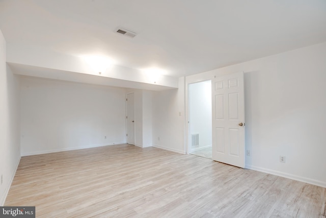 spare room with light hardwood / wood-style floors