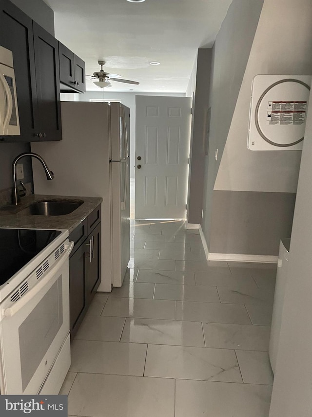 kitchen featuring white range with electric cooktop, ceiling fan, and sink