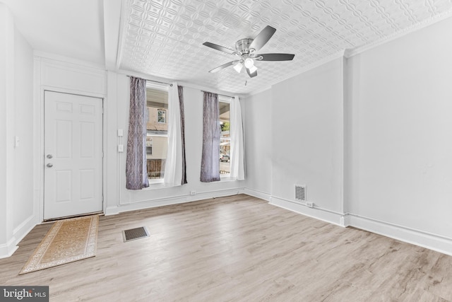 unfurnished room with ceiling fan and light wood-type flooring