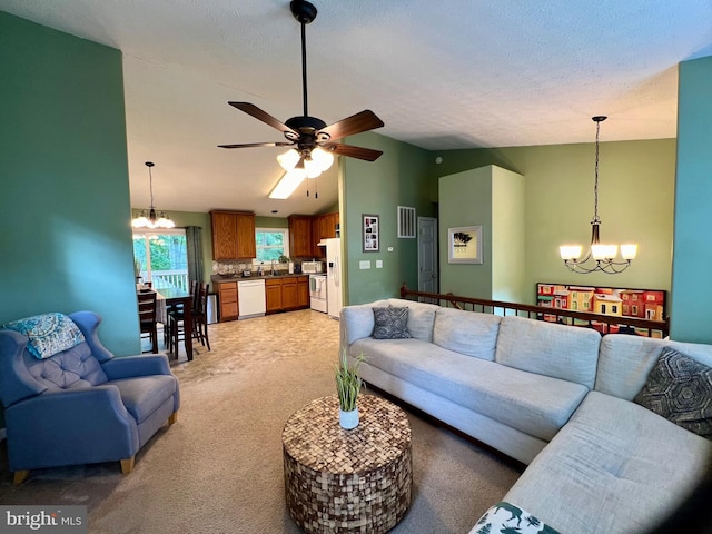 living room featuring a textured ceiling, ceiling fan with notable chandelier, light colored carpet, and lofted ceiling