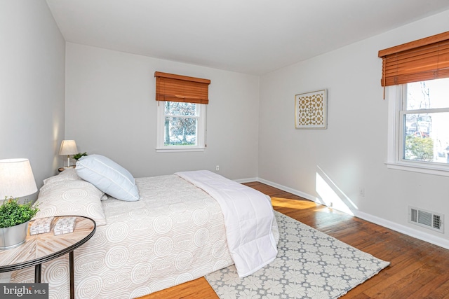 bedroom with wood-type flooring