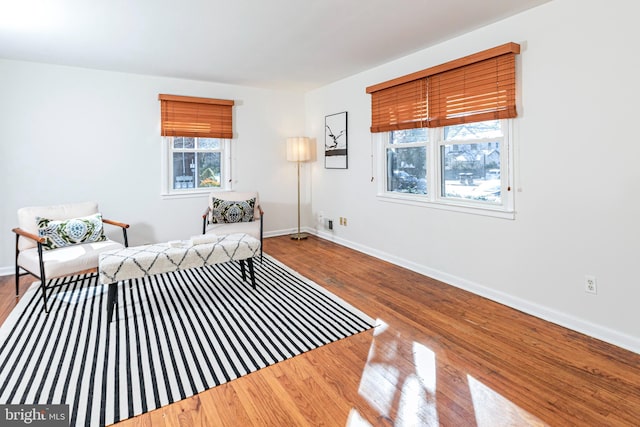 living area with wood-type flooring