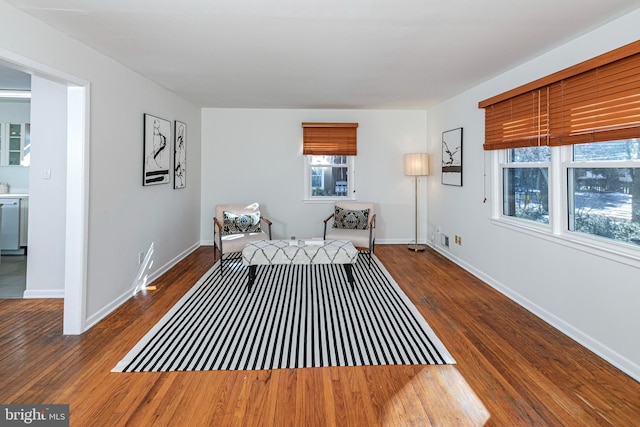 living area with dark hardwood / wood-style floors