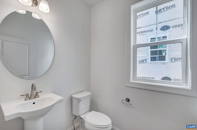 bathroom with toilet and sink