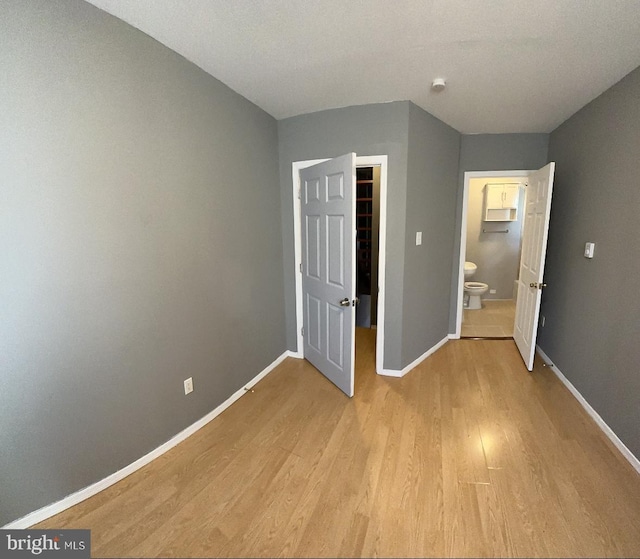 unfurnished bedroom with light hardwood / wood-style floors