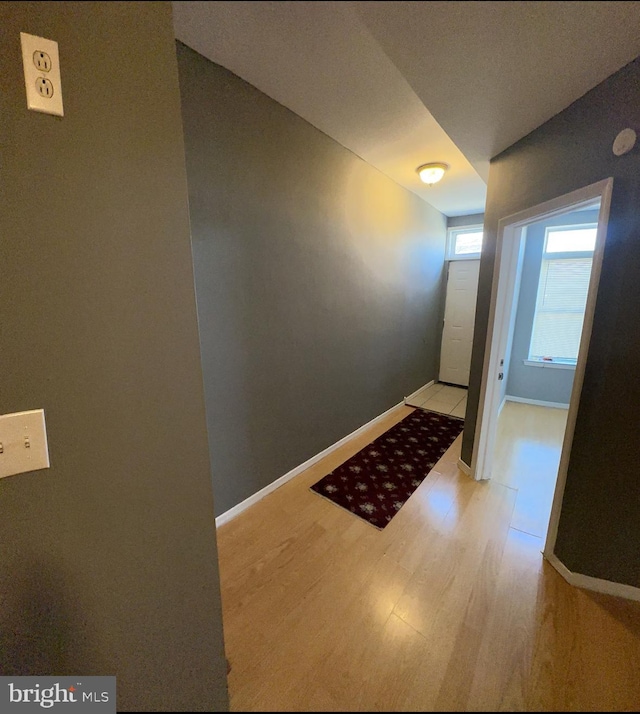 corridor featuring light hardwood / wood-style floors