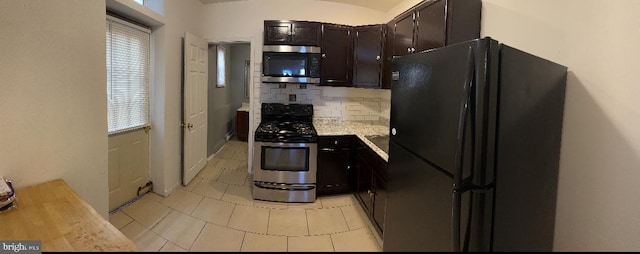 kitchen featuring decorative backsplash, dark brown cabinets, and appliances with stainless steel finishes