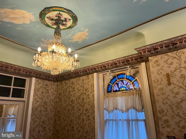 interior details featuring a chandelier