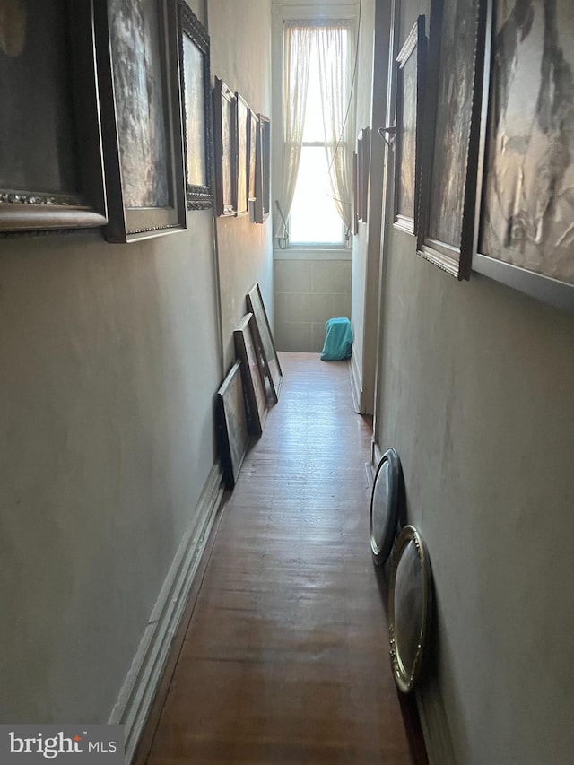 corridor featuring hardwood / wood-style floors