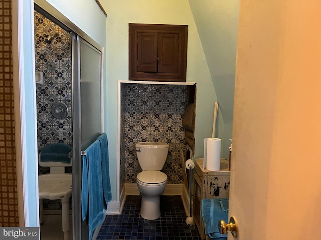 bathroom featuring tile patterned floors and toilet