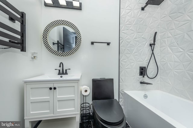 full bathroom with vanity, toilet, and tiled shower / bath