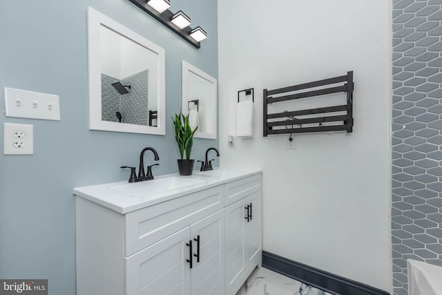 bathroom featuring radiator, vanity, and walk in shower