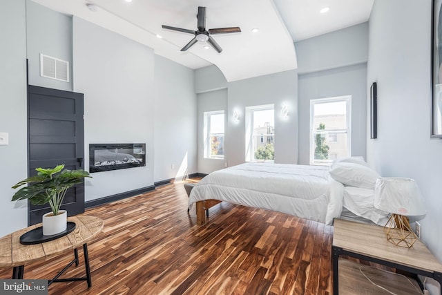 bedroom with wood-type flooring and ceiling fan