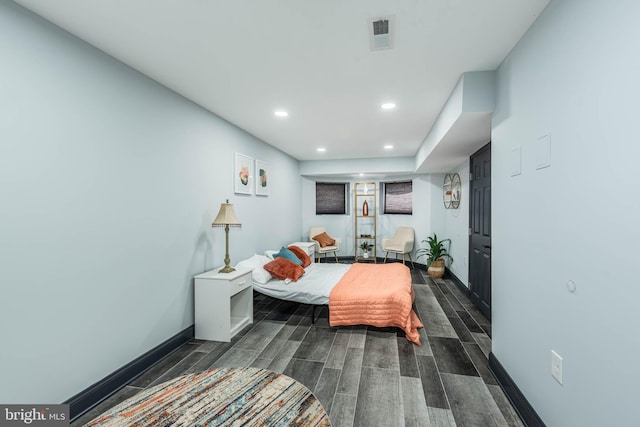 bedroom with dark hardwood / wood-style flooring