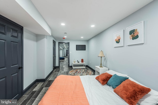 bedroom with dark wood-type flooring