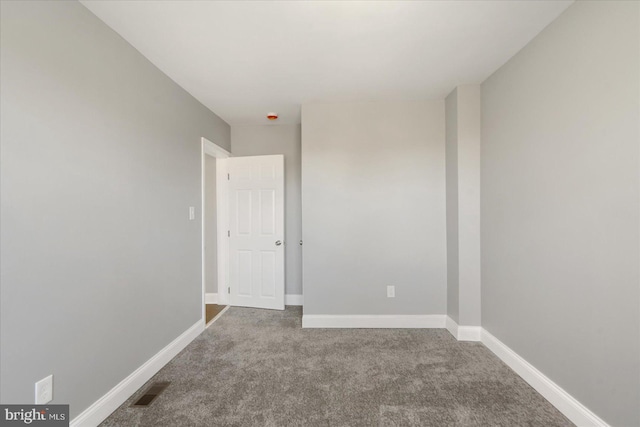 empty room featuring carpet flooring