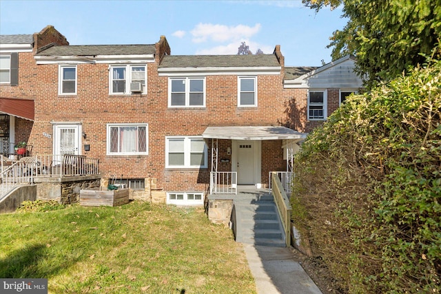 view of property featuring a front yard