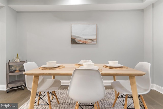 dining room with hardwood / wood-style flooring