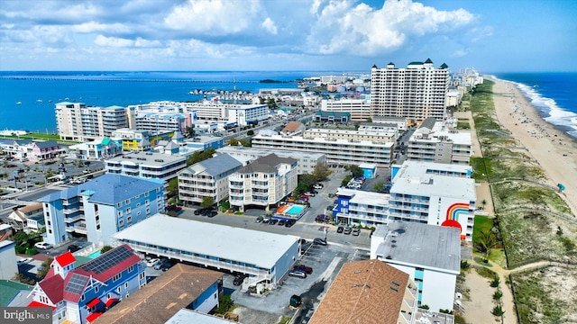 bird's eye view with a water view and a view of the beach