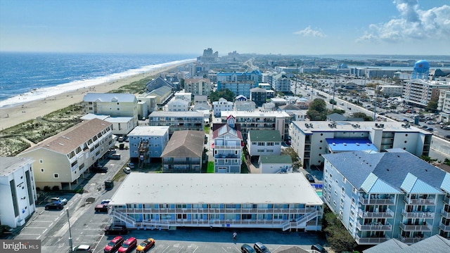 bird's eye view with a view of the beach and a water view