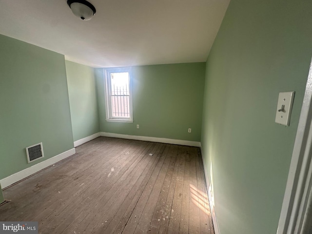 empty room with wood-type flooring