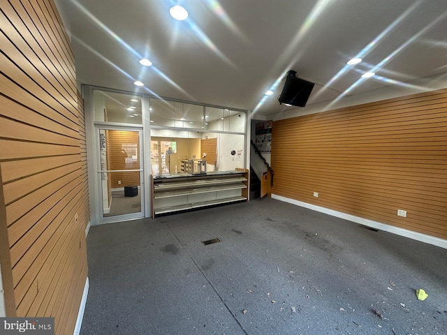 garage with wood walls