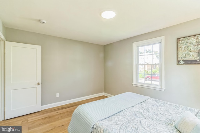 bedroom with light hardwood / wood-style flooring