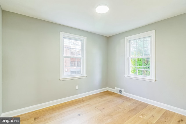 unfurnished room featuring light hardwood / wood-style flooring