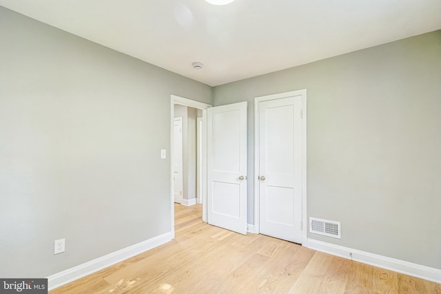 unfurnished bedroom featuring light hardwood / wood-style floors