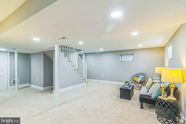 living area with light carpet