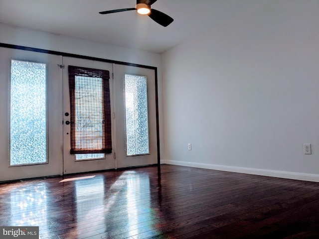 entryway with dark hardwood / wood-style floors and ceiling fan