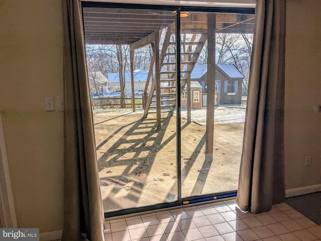 entryway with tile patterned floors