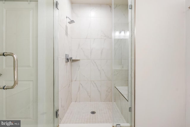 bathroom with a shower with shower door