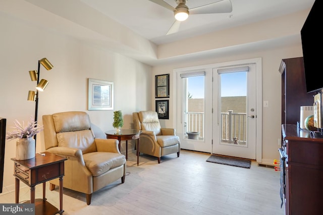 sitting room featuring ceiling fan and light hardwood / wood-style flooring