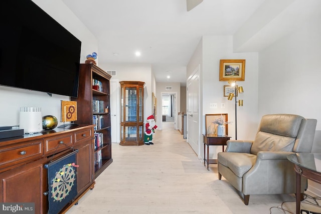 sitting room featuring light wood-type flooring